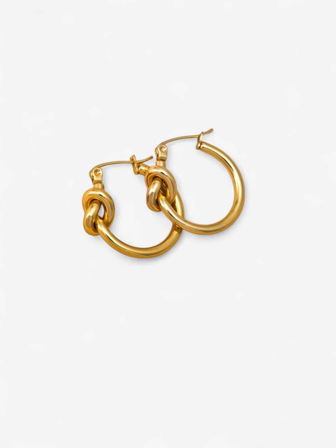 KNOTTED GRACE | AROS CON NUDO ELEGANTE Y SIGNIFICADO INTERIOR